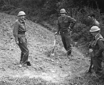 Michael Perrin, John Lansdale, Jr., Samuel Goudsmit, and Eric Welsh search for uranium in a field at Haigerloch, Germany